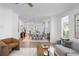 Spacious living area showcasing open layout with dining and kitchen, perfect for entertaining guests or relaxing with Gathering at 628 Skytop Dr # 158, Cumming, GA 30040