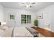 Staged bedroom with a window and ensuite bath at 651 Coligny Ct, Atlanta, GA 30350
