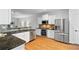 Modern kitchen with granite countertops and stainless steel appliances, ideal for cooking at 651 Coligny Ct, Atlanta, GA 30350