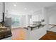 Well-lit kitchen with dark countertops and white cabinets, perfect for Gathering meals at 651 Coligny Ct, Atlanta, GA 30350