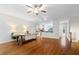 Beautiful open-concept living area with hardwood floors, fireplace, and plenty of space at 651 Coligny Ct, Atlanta, GA 30350