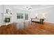 Bright and airy living room with fireplace, hardwood floors, and large windows at 651 Coligny Ct, Atlanta, GA 30350