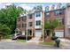 Attractive multi-story townhouse featuring a front-entry garage and manicured landscaping at 651 Coligny Ct, Atlanta, GA 30350