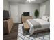 Bedroom featuring hardwood floors, neutral walls, a ceiling fan, and bright natural light at 303 Latimer Se St, Marietta, GA 30008
