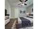 Bedroom featuring hardwood floors, neutral walls, a ceiling fan, and bright natural light at 303 Latimer Se St, Marietta, GA 30008