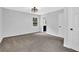 This bedroom features neutral paint, carpet flooring, a window, bathroom access and closet for comfortable living at 3181 Woodbridge Ct, Snellville, GA 30039