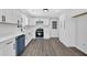 Kitchen featuring white cabinets, stainless steel appliances, and new wood flooring at 3181 Woodbridge Ct, Snellville, GA 30039