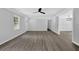 An open living space with modern flooring, recessed lights, a doorway, and natural lighting at 3181 Woodbridge Ct, Snellville, GA 30039
