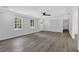 Spacious living room with modern flooring, recessed lighting, and a doorway leading to other rooms at 3181 Woodbridge Ct, Snellville, GA 30039