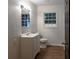 Bright bathroom featuring a vanity with sink and a large mirror at 3790 Village Sw Dr, Atlanta, GA 30331