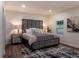 Cozy bedroom showcasing a king-size bed, stylish nightstands, and a contemporary rug at 3790 Village Sw Dr, Atlanta, GA 30331