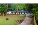 Charming single-story home with a well-manicured front yard and inviting curb appeal at 3790 Village Sw Dr, Atlanta, GA 30331