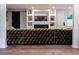 Comfortable living room featuring a stylish fireplace and modern built-in shelving at 3790 Village Sw Dr, Atlanta, GA 30331