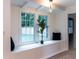 Inviting window seat framed by light-filled windows, complemented by stylish lighting and decor at 3790 Village Sw Dr, Atlanta, GA 30331