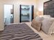 Spacious bedroom features a king-size bed, closet, and ensuite bathroom access at 3790 Village Sw Dr, Atlanta, GA 30331