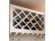 Custom white wine rack above glasses storage adds a touch of elegance and functionality to the space at 3790 Village Sw Dr, Atlanta, GA 30331