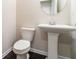 Stylish half-bathroom with a pedestal sink, modern toilet, and neutral wall paint at 382 Mulberry Se Row, Atlanta, GA 30354