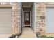 Inviting front entry with a red door, brick accents, and neutral siding, creating a warm welcome at 382 Mulberry Se Row, Atlanta, GA 30354