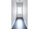 Clean hallway with a white door, light walls, and dark hardwood flooring at 382 Mulberry Se Row, Atlanta, GA 30354