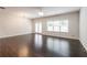 Bright and airy living room with hardwood floors, large windows, and access to the backyard at 382 Mulberry Se Row, Atlanta, GA 30354