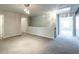 Upstairs loft area with plush carpeting, modern lighting, and access to bedrooms at 382 Mulberry Se Row, Atlanta, GA 30354
