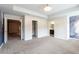 A large bedroom with carpet, recessed lights, and views to other rooms at 382 Mulberry Se Row, Atlanta, GA 30354