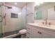 Beautiful bathroom with a glass enclosed shower, sleek vanity with quartz countertop and elegant fixtures at 5445 Eva Mamie Ln, Stone Mountain, GA 30083