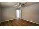 Bedroom with hardwood flooring, ceiling fan, and white trim on the door at 5445 Eva Mamie Ln, Stone Mountain, GA 30083