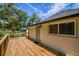 Wooden deck outside features wood railings, and access to the house and backyard at 5445 Eva Mamie Ln, Stone Mountain, GA 30083