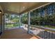 Inviting covered front porch with stylish railings and a serene outdoor view at 5445 Eva Mamie Ln, Stone Mountain, GA 30083