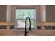 Kitchen detail showcasing a modern sink and window with natural light at 5445 Eva Mamie Ln, Stone Mountain, GA 30083