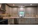 Modern kitchen featuring stainless steel appliances, sleek cabinetry, and hardwood floors at 5445 Eva Mamie Ln, Stone Mountain, GA 30083