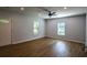 Inviting living room featuring luxury vinyl plank flooring, a stylish front door and plenty of natural light from the windows at 5445 Eva Mamie Ln, Stone Mountain, GA 30083