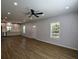 Bright and airy living room with modern finishes, recessed lighting, new windows and luxury vinyl plank flooring at 5445 Eva Mamie Ln, Stone Mountain, GA 30083