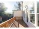 Wooden deck with railings and view of trees and landscaped backyard at 626 Skytop Dr # 159, Cumming, GA 30040