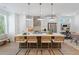 Bright kitchen boasts an island with seating, stainless steel appliances, and stylish pendant lighting at 626 Skytop Dr # 159, Cumming, GA 30040