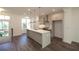 Bright kitchen with stainless steel appliances, island and view of the outdoors at 626 Skytop Dr # 159, Cumming, GA 30040