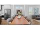 Bright living and dining area features neutral colors, an open concept, and stainless steel appliances in the kitchen at 626 Skytop Dr # 159, Cumming, GA 30040