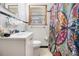 Bathroom featuring a vanity, mirror, and colorful shower curtain at 965 Laurel St, Morrow, GA 30260