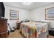 A cozy bedroom with two windows, wood trim, and white painted walls at 965 Laurel St, Morrow, GA 30260