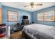 Bedroom with two large windows, ceiling fan, and dresser for ample storage space at 965 Laurel St, Morrow, GA 30260
