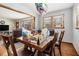 Dining area featuring wooden table and chairs plus view to living area at 965 Laurel St, Morrow, GA 30260