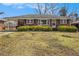 Lovely brick home with covered carport and manicured front yard at 965 Laurel St, Morrow, GA 30260
