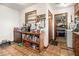 Cozy kitchen area with a storage shelf, pantry, and convenient access to the laundry area at 965 Laurel St, Morrow, GA 30260
