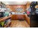 Kitchen featuring tile flooring, wood cabinets, and functional layout at 965 Laurel St, Morrow, GA 30260