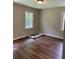 Bright bedroom featuring newly installed vinyl plank floors and a window at 2245 Polar Rock Sw Ave, Atlanta, GA 30315