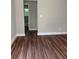 Bedroom area with wood flooring, fresh paint, leading to the ensuite bathroom at 2245 Polar Rock Sw Ave, Atlanta, GA 30315