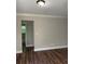 Bedroom area with wood flooring, fresh paint, leading to the ensuite bathroom at 2245 Polar Rock Sw Ave, Atlanta, GA 30315