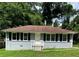 Charming single-story home with a well-manicured lawn and lush landscaping at 2245 Polar Rock Sw Ave, Atlanta, GA 30315