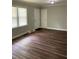 Living area featuring wood floors, fresh paint, and natural light from the windows at 2245 Polar Rock Sw Ave, Atlanta, GA 30315